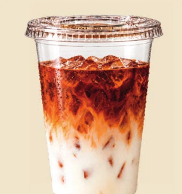 Vaso con la bebida y tapa